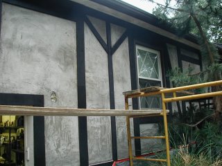 Tudor style house waiting
                for finish coat