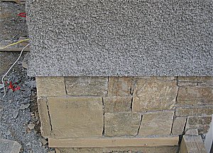 Pebble dash stucco on new house